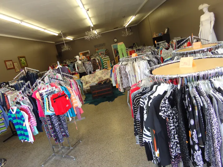 Clothing racks at an Of One Accord thrift store